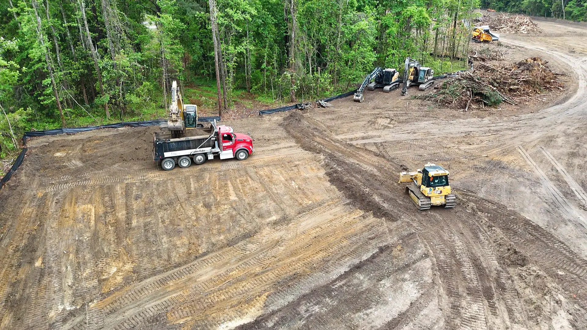 Earthco Construction crew and heavy equipment at work on a grading project